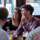 Illustration for article titled Incredibly Tragic: Everyone At This Trivia Table Wrongly Assumes At Least One Of Their Friends Is Still Having Fun